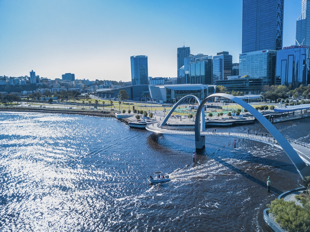 aerial photography of bridge over river near high-rise building