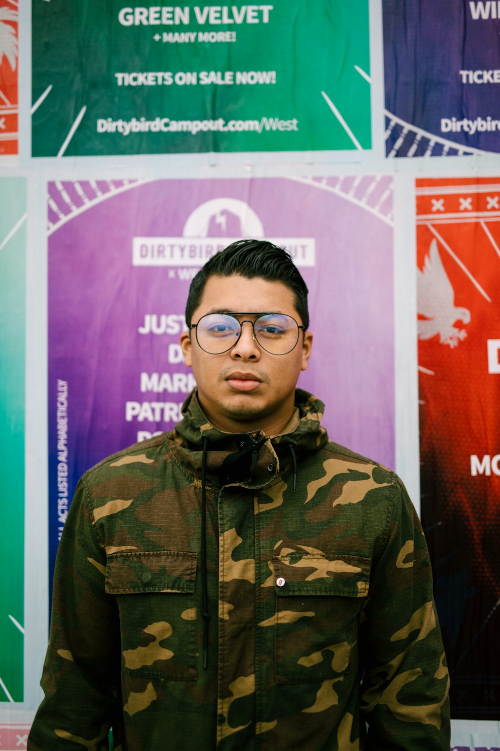 man in multicolored camouflage pullover