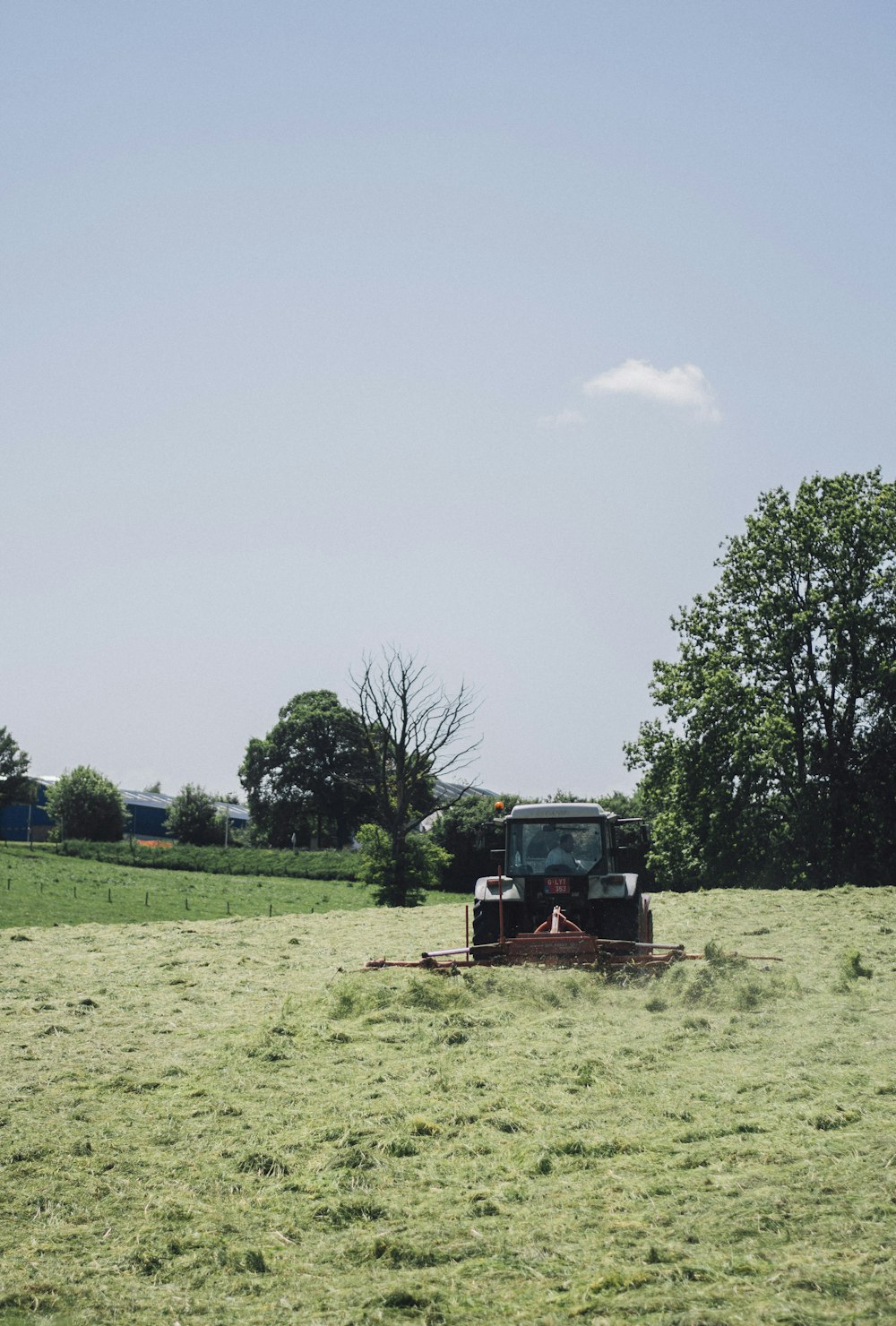 black tractor under blue sky