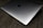 Close-up of a sleek laptop with a matte black shunyolabs skin applied, highlighting the precise cut and smooth finish.