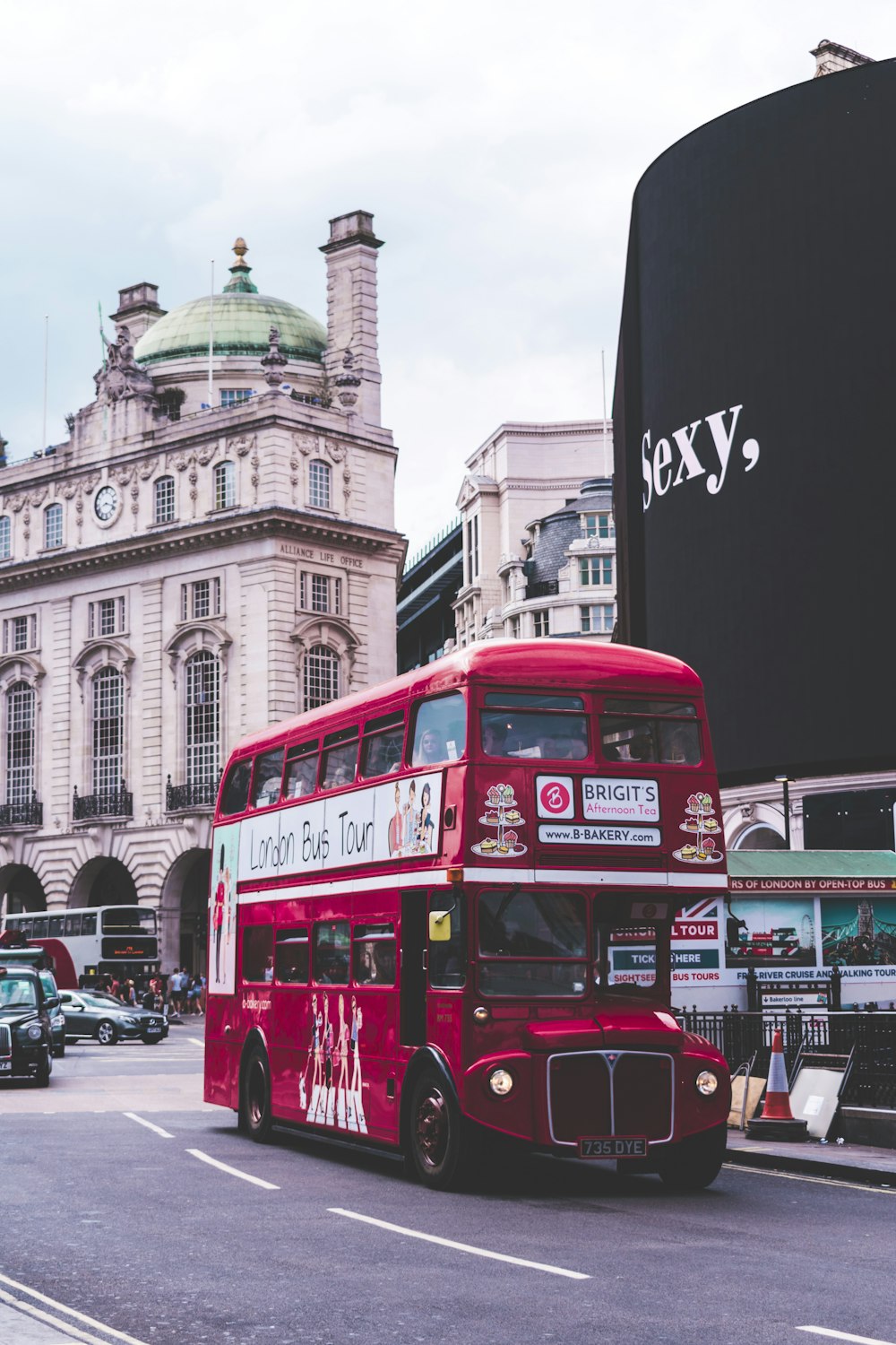 red bus on road