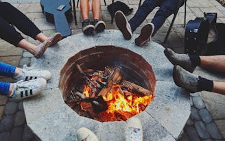 Friends gathered around a fire pit, sharing stories and laughter.