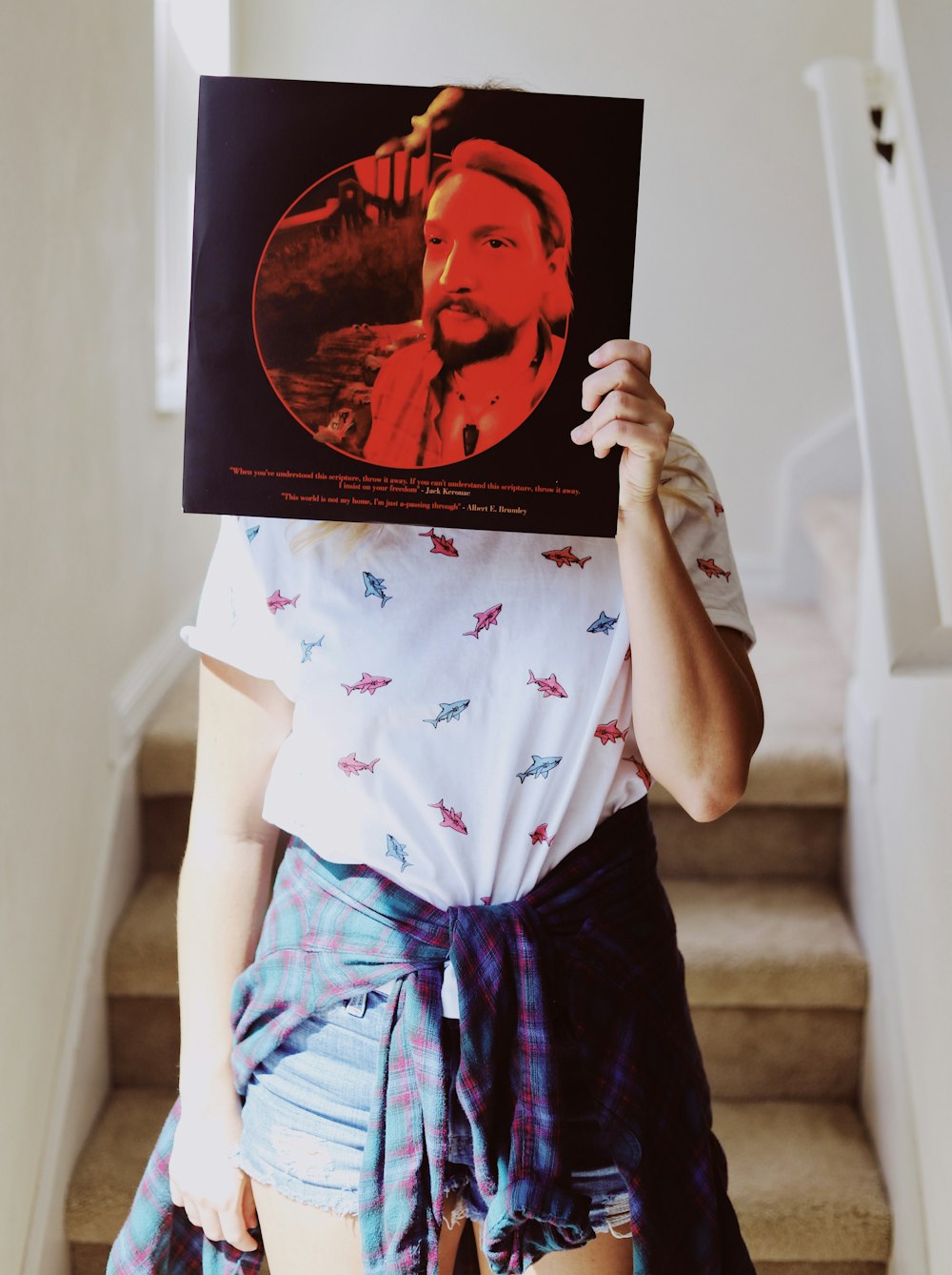 person holding vinyl sleeve