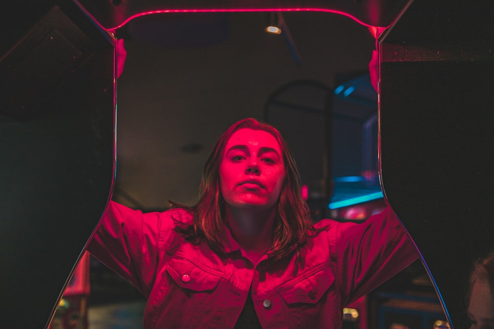 woman standing near red light