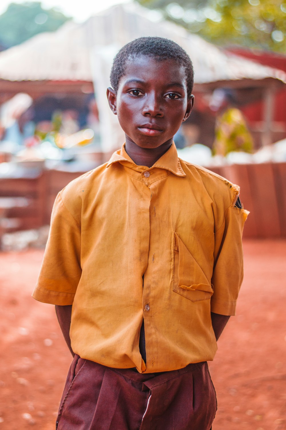 selective focus photo of boy standing