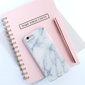 rose gold iPhone 6s and white and gray marble case