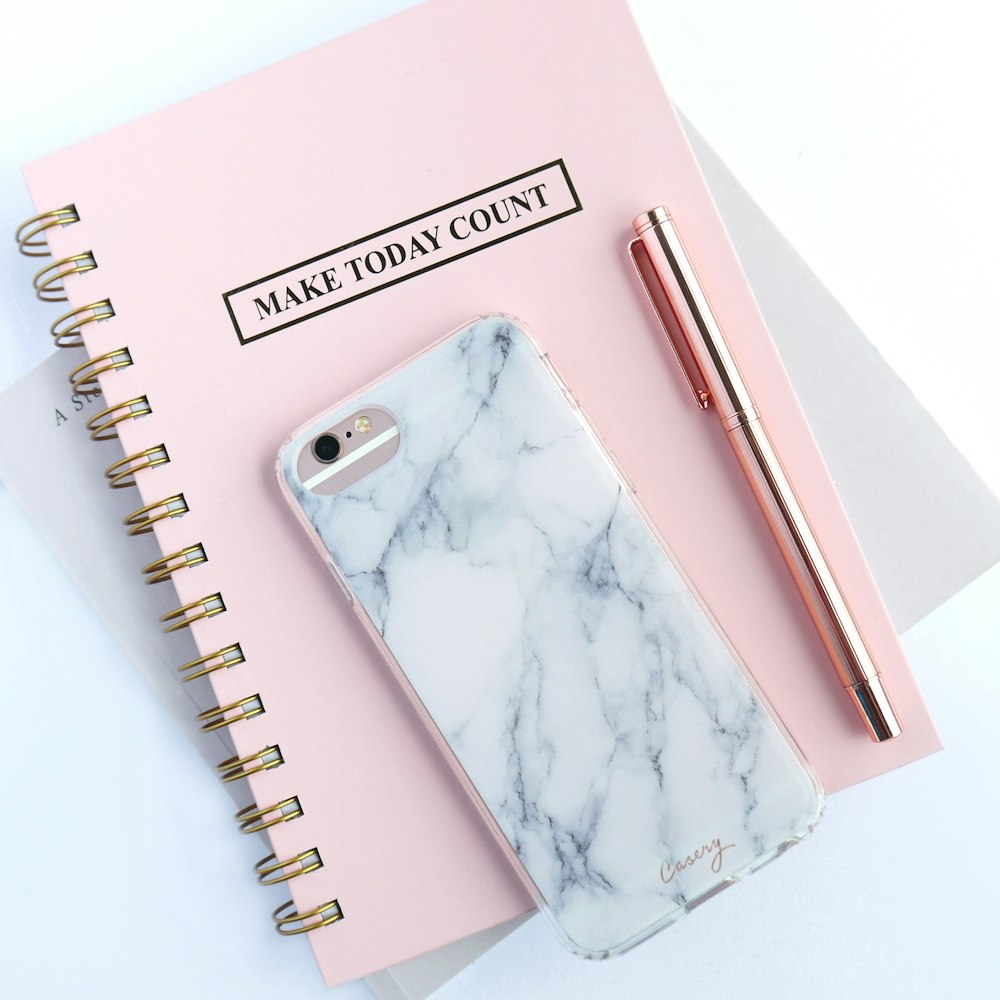 rose gold iPhone 6s and white and gray marble case