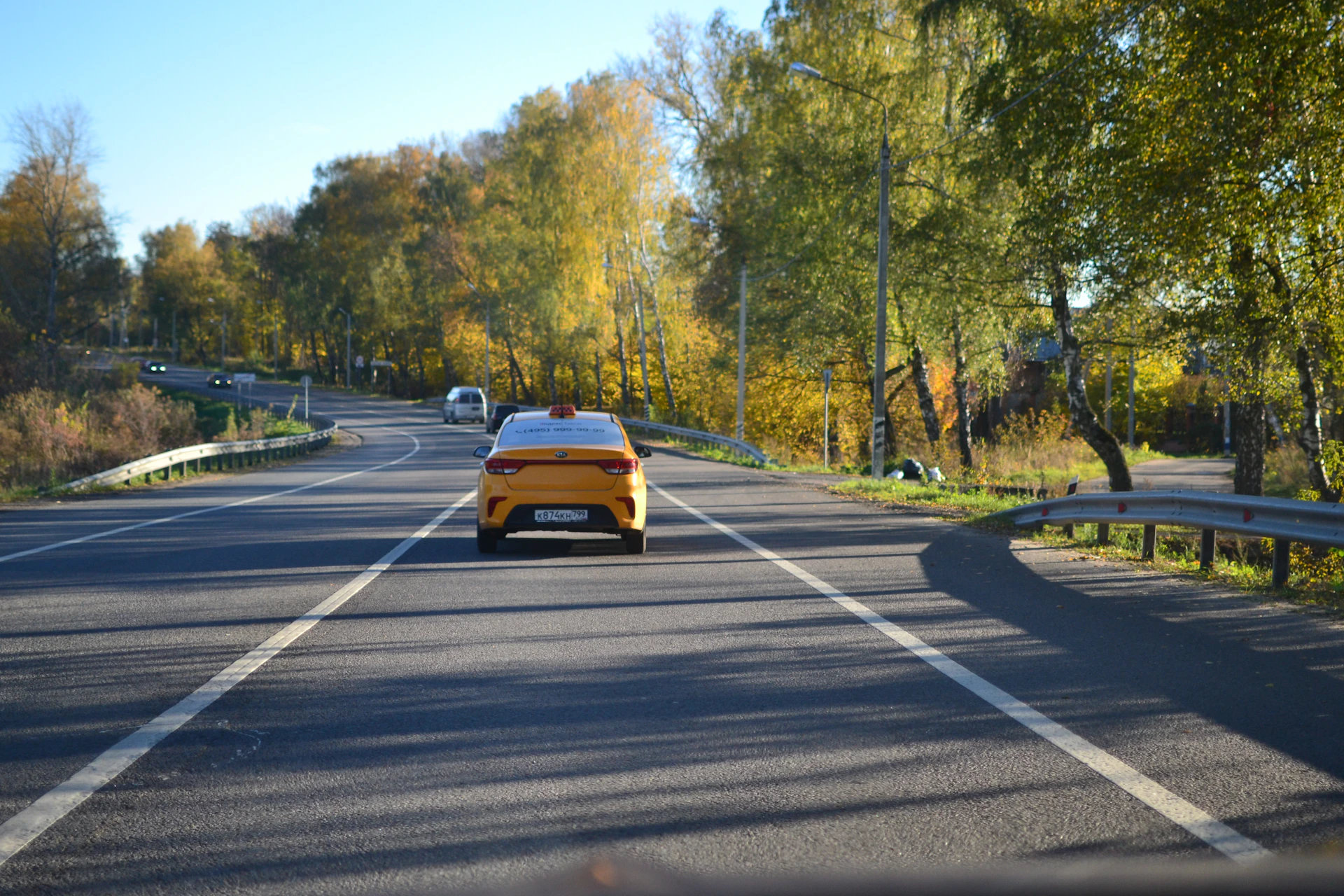 woman wearing yellow long-sleeved dress under white clouds and blue sky during daytime