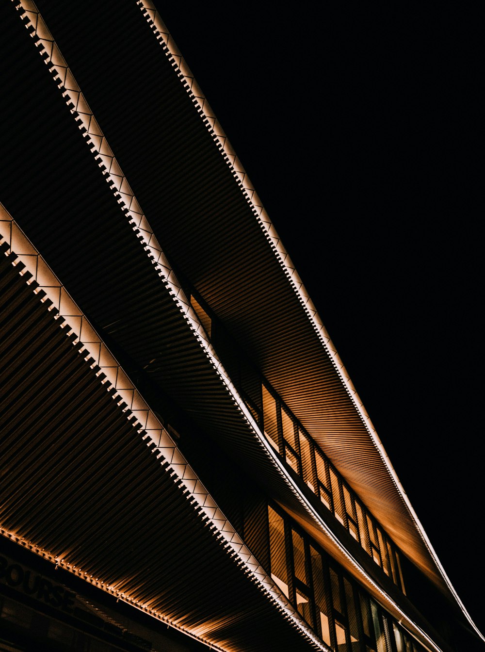 a close up of the side of a building at night