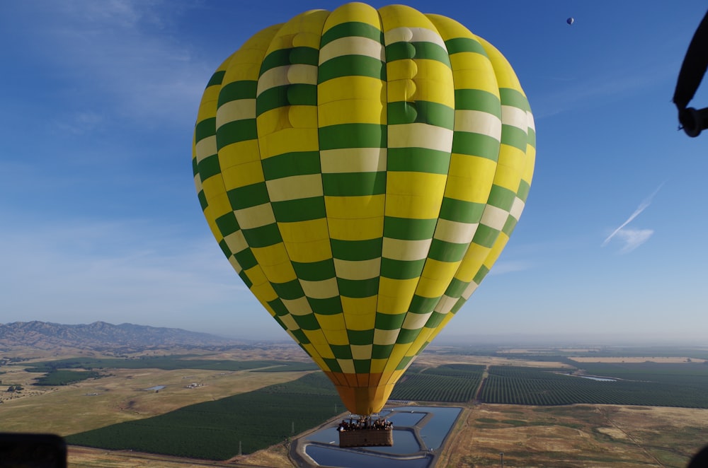 green and white hot air balloon during daytime