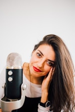 smiling woman beside microphone