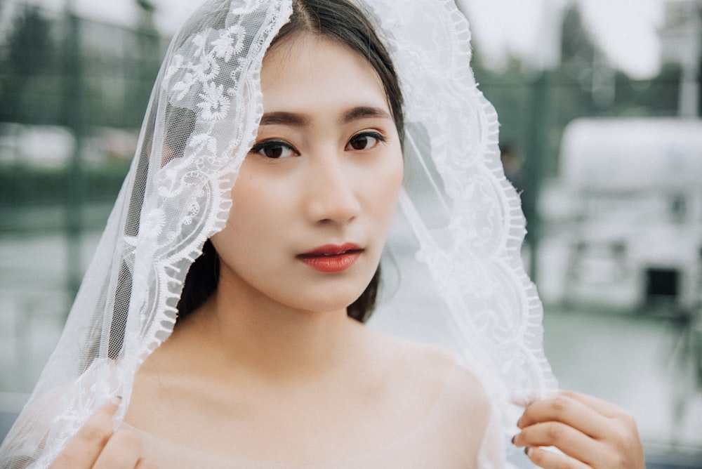 woman wearing wedding veil during daytime