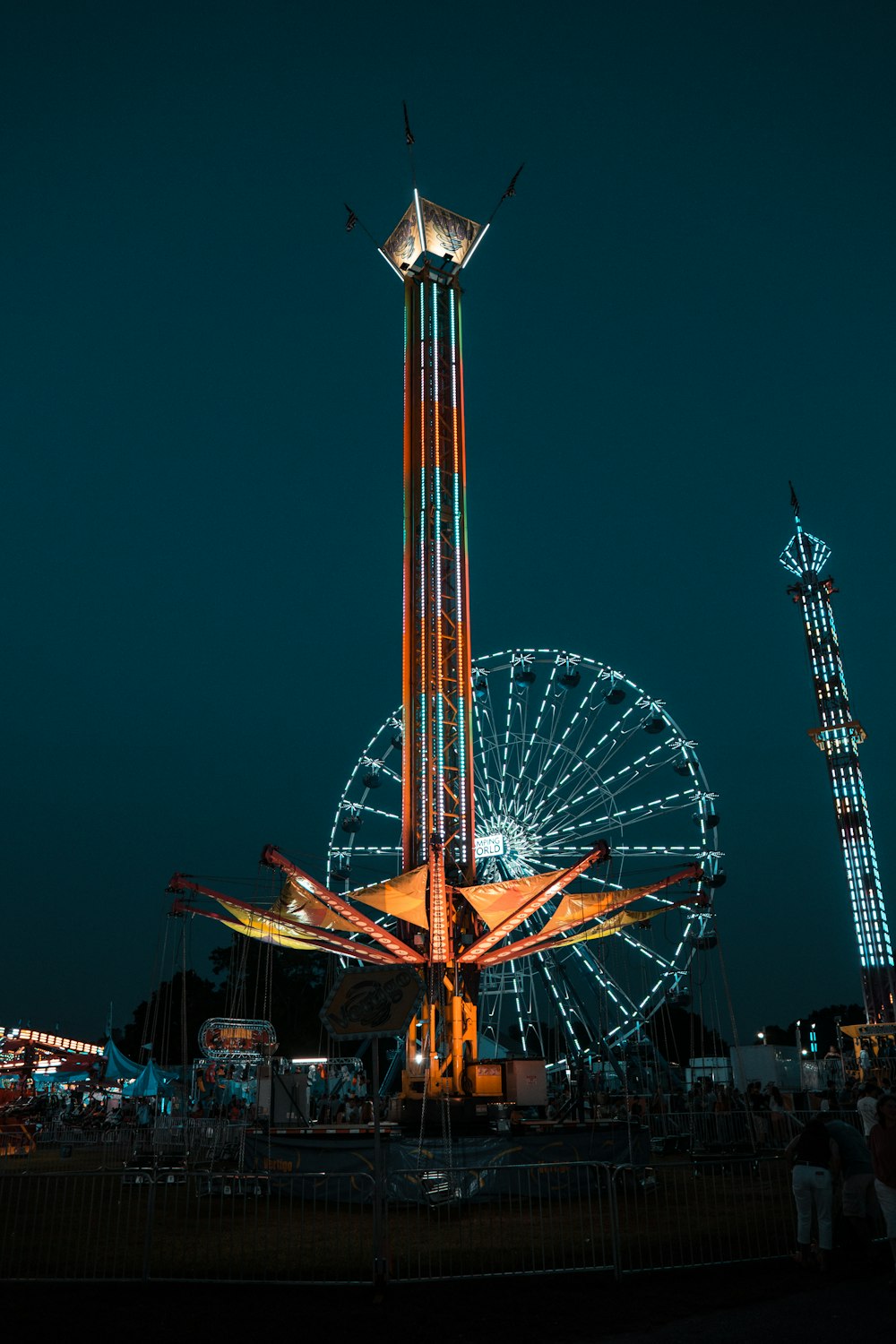 lighted Ferris wheel during nighttime