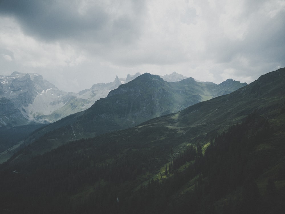 green mountain under white sky