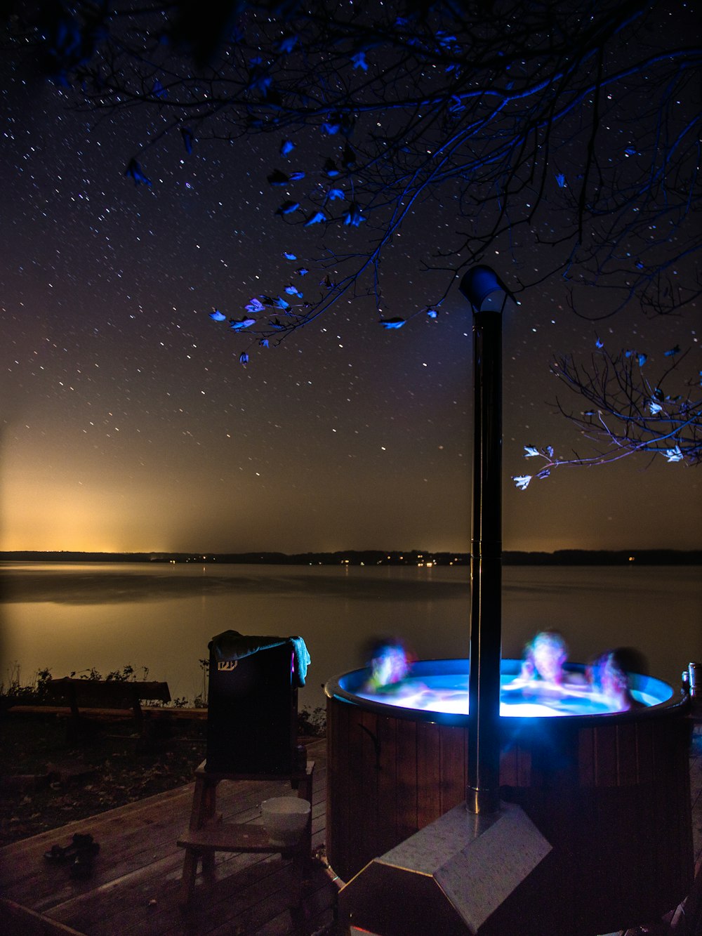 a hot tub sitting on top of a wooden deck