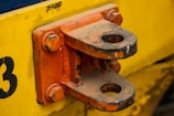 A close-up of a trailer hitch connecting to a truck.