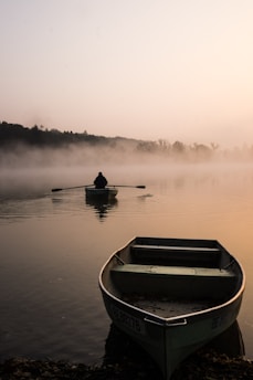 two beige boat on water