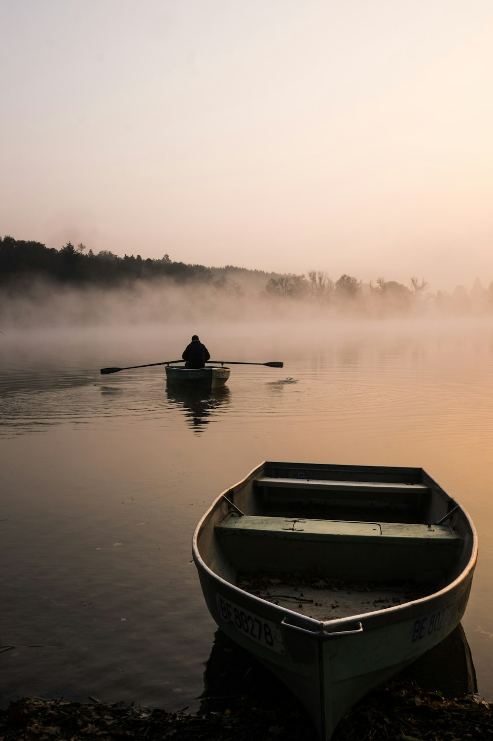 two beige boat on water