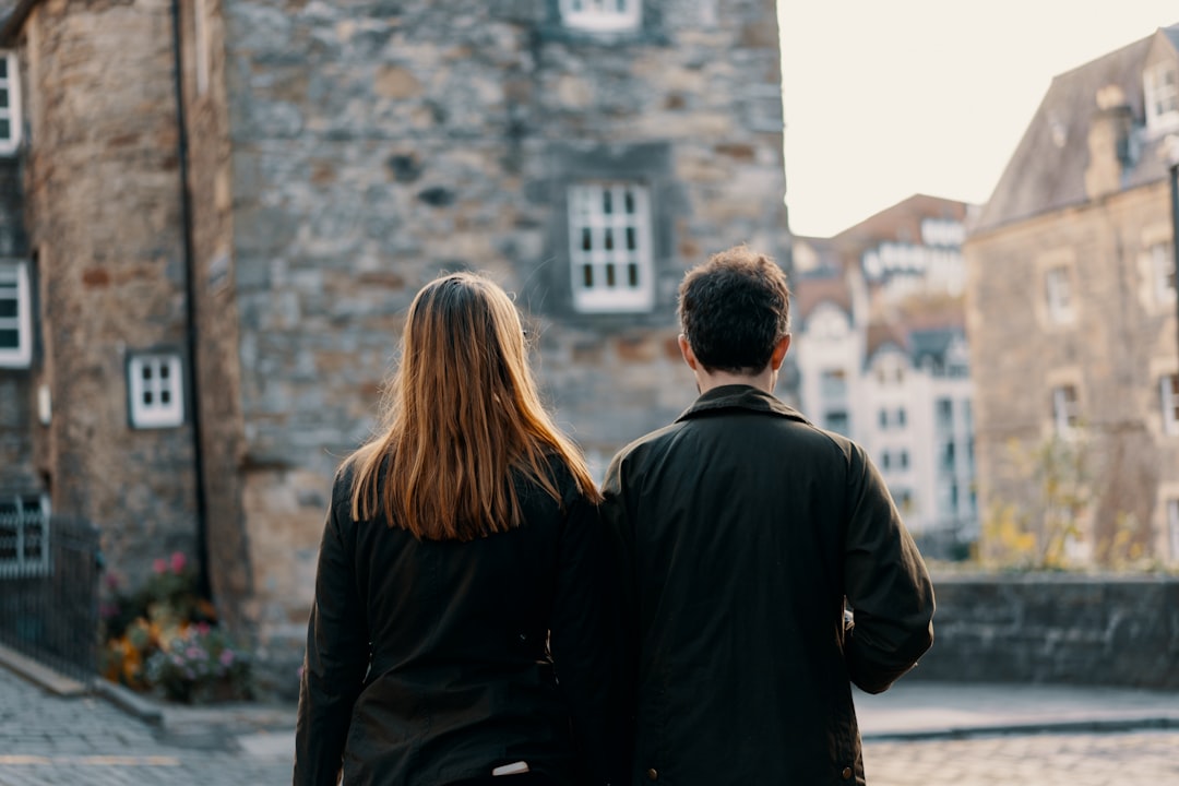 man standing beside woman during daytime