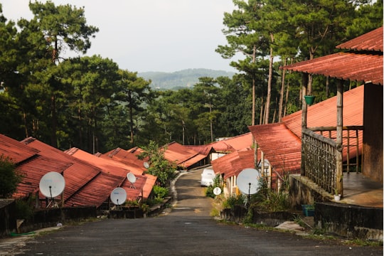 gray satelite dish beside house under white sky in Shillong India