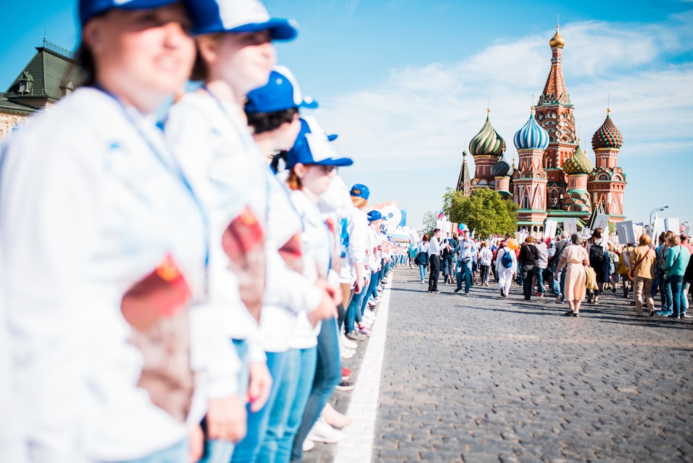 group of people lining up during daytime