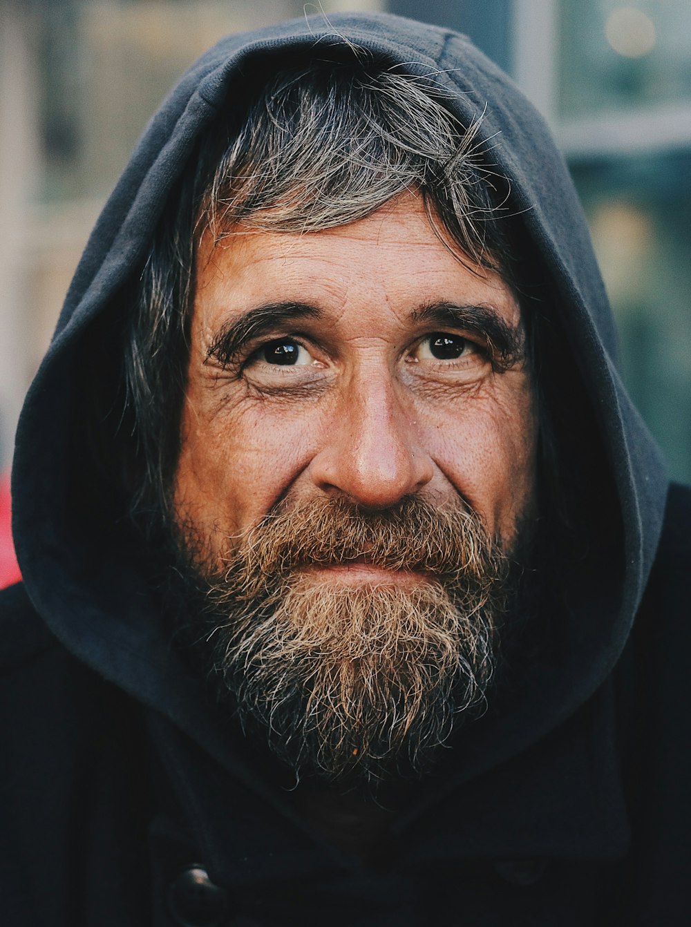 portrait photo of a man wearing hoodie