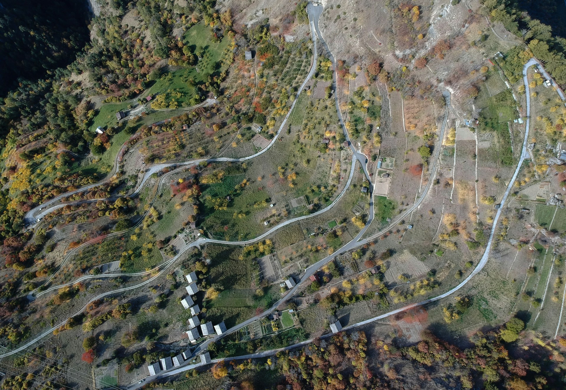 top view of village on hill near body of water