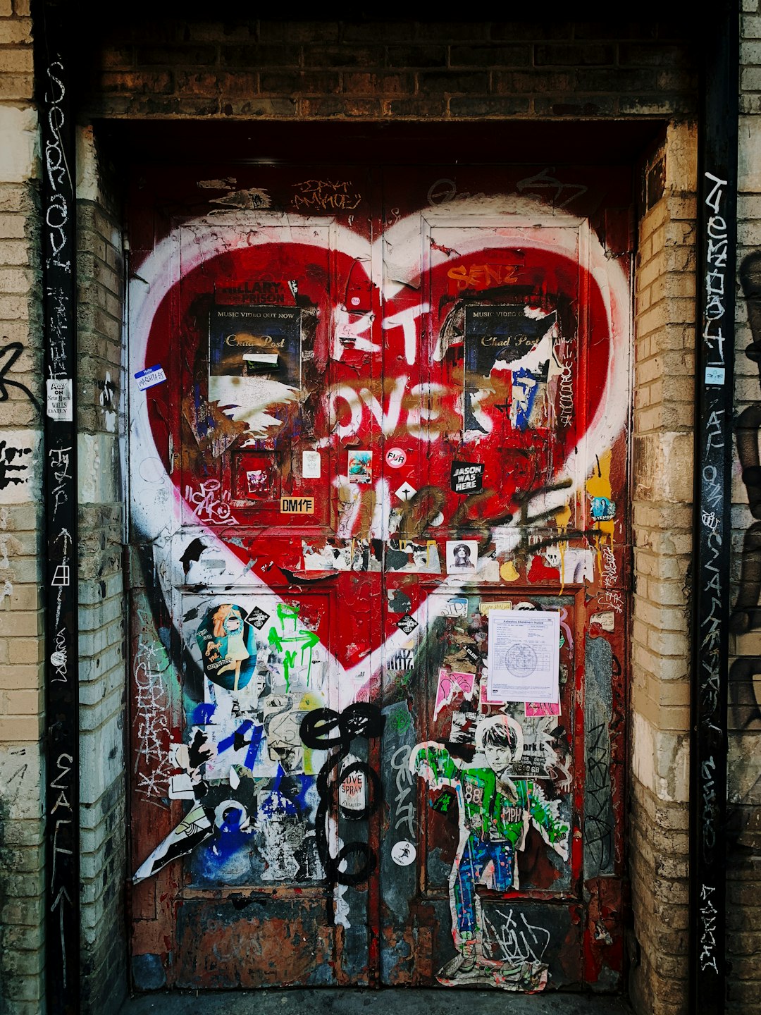 red door with white heart paint