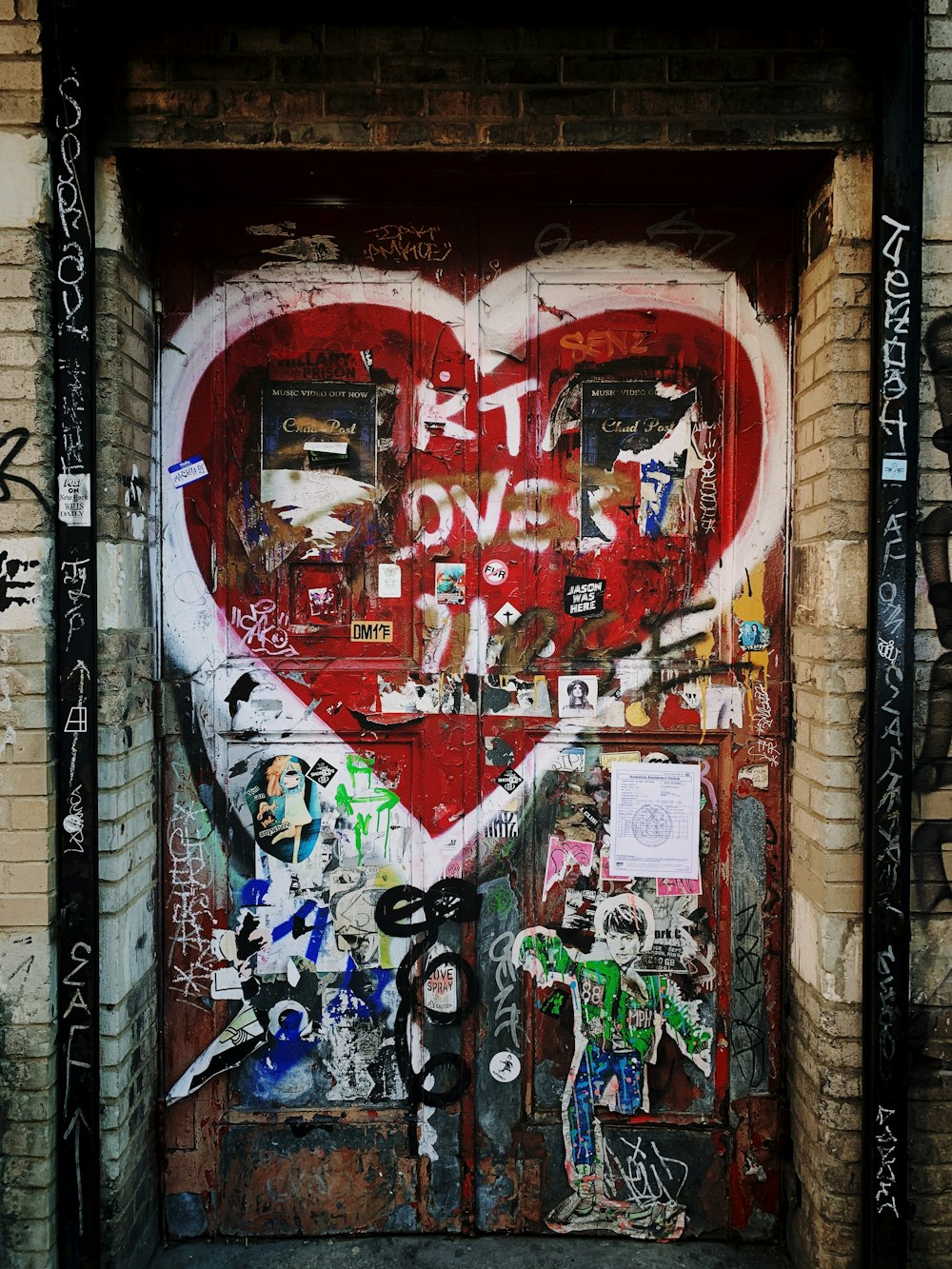 red door with white heart paint