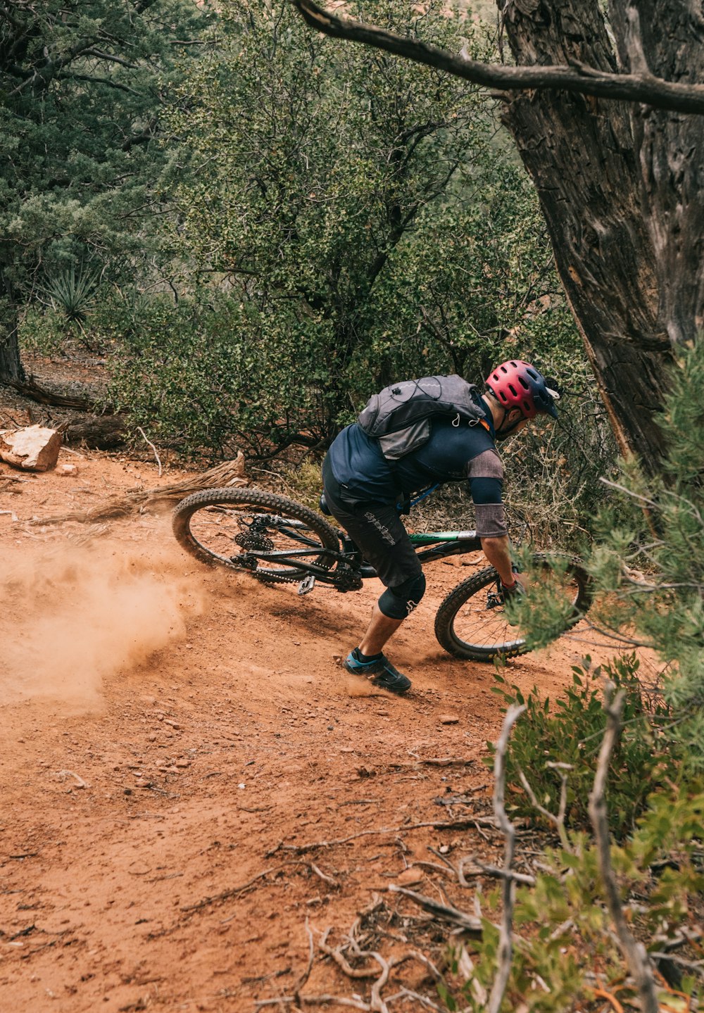 man on bike on downhill trail