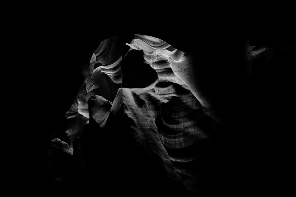 a black and white photo of a rock formation