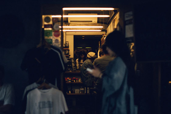 A warm, candid photo of the éclatlien founder sharing ideas with event vendors in a cozy, modern workspace.