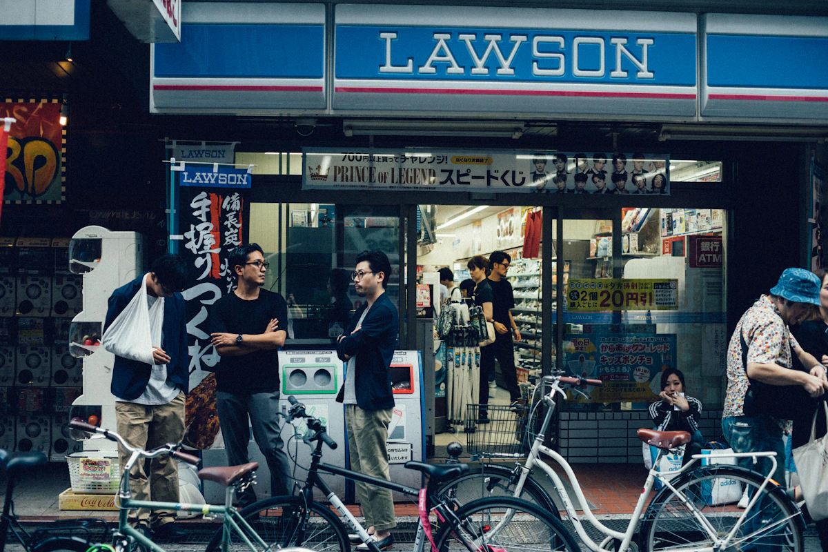 A Lawson convenience store lit up at night in Osaka