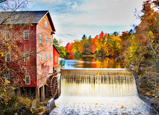 4-storey house with water mill near body of water in Augusta United States
