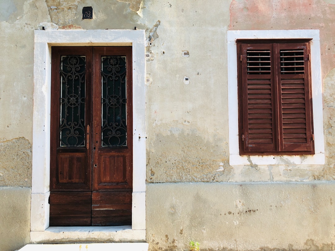 closed wooden door and window