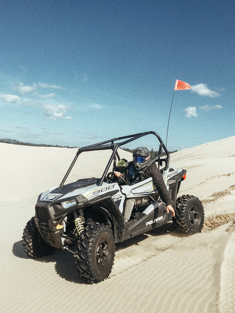 person riding dune buggy