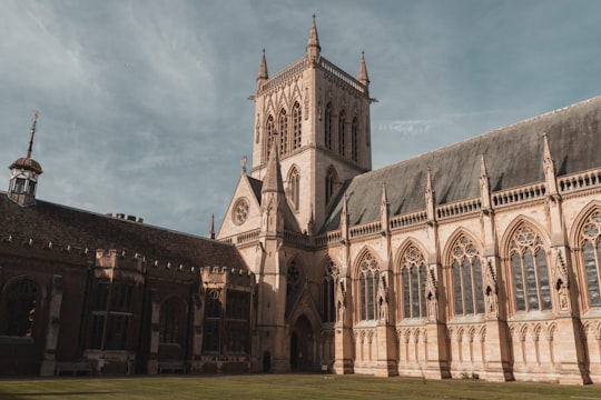 selective photography of brown and white concrete building under white sky during daytime in St John's College, Chapel United Kingdom