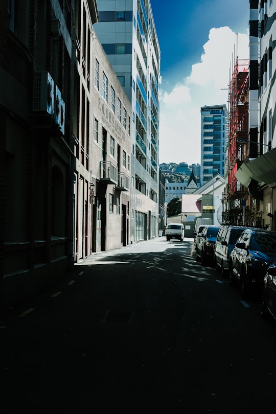 cars parked in between buildings in Wellington New Zealand