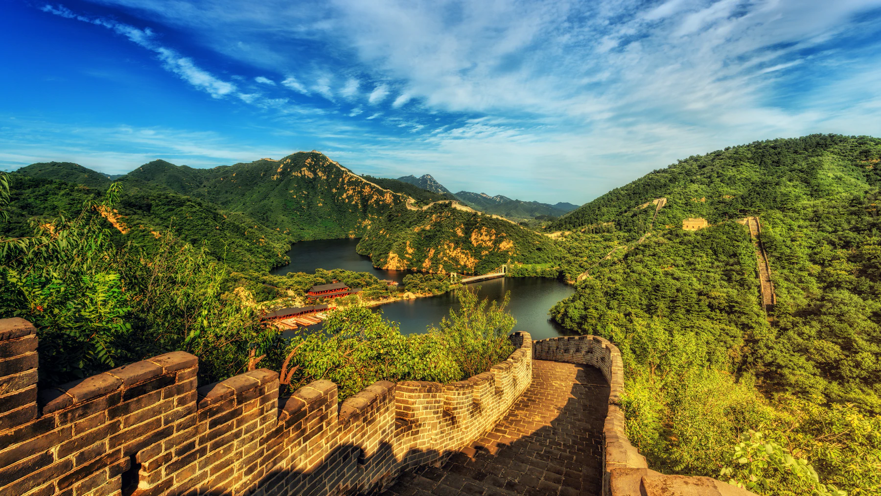 The Great Wall winding over hills at golden hour