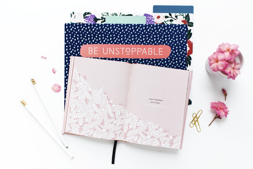 pink and white floral book