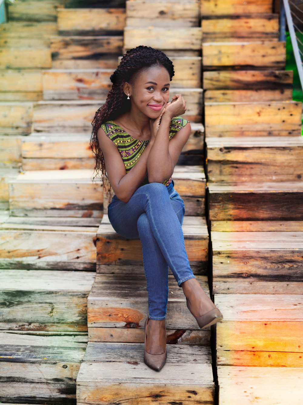 woman sitting on brown wooden chair