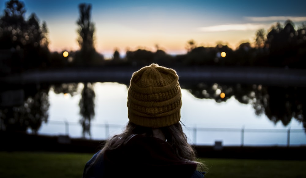 woman standing facing at river