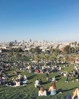 A vibrant city park with diverse people enjoying a sunny day, representing community.