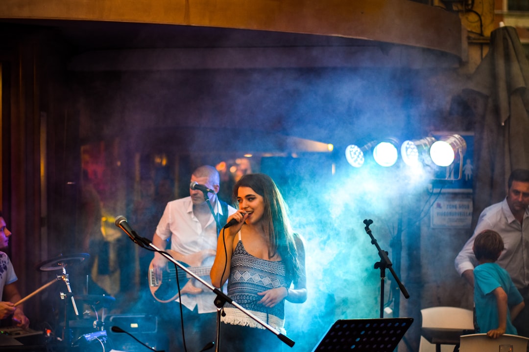 woman singing on stage