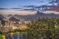 Night view of Rio de Janeiro’s Christ the Redeemer statue with subtle glowing lights.