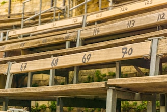 Finished wooden bleachers installed outdoors at a residential property.