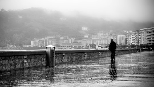 person walking on bridge in San Sebastián Spain