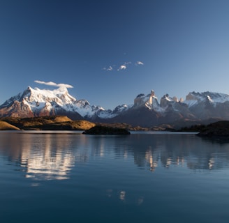 snow covered mountain in reflective photography