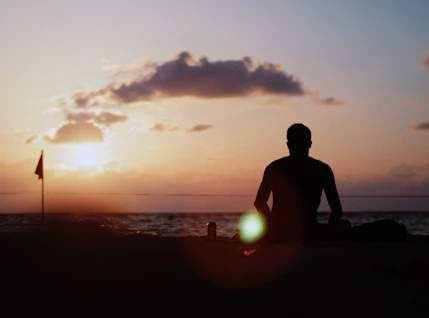 silhouette of person near beach