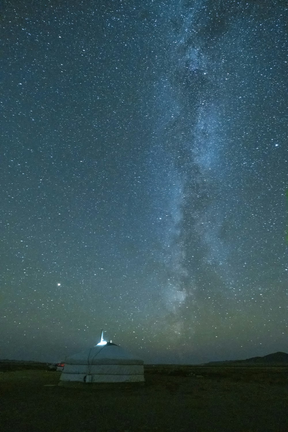 white tent under milky way